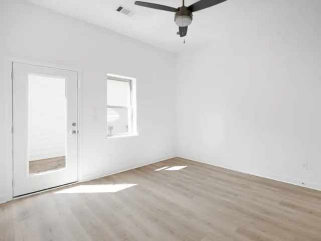 an empty room with a empty space and a window