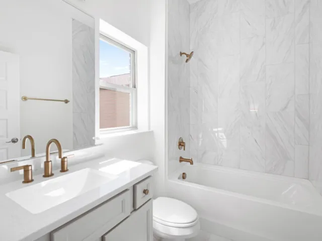 a bathroom with a sink toilet and bathtub