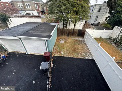a view of a backyard with sitting area