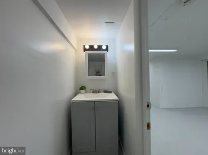 a bathroom with a sink and mirror