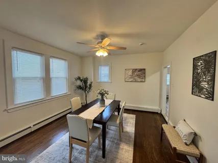 a dining room with furniture and window