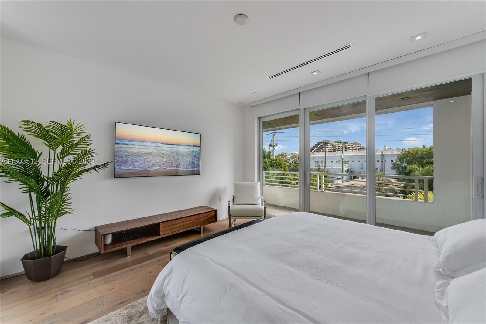 330 Fernwood Road, Unit 1 Key Biscayne, FL 33149 - Photo 20 of 29 a bedroom with a bed and a window