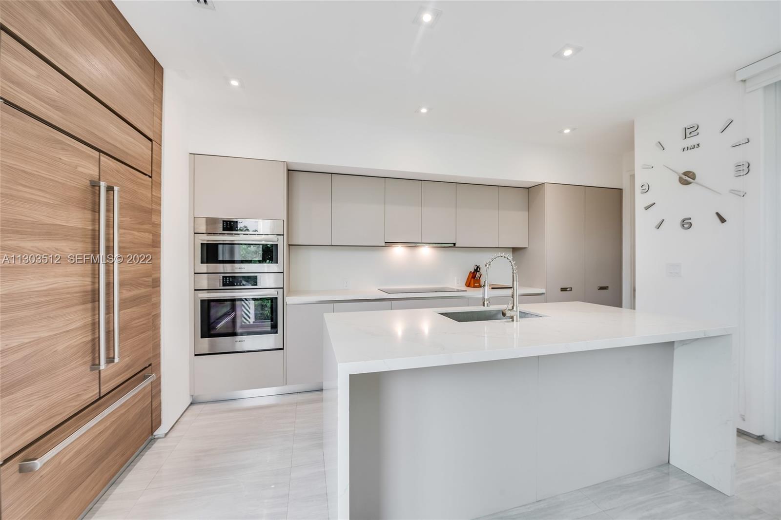 330 Fernwood Road, Unit 1 Key Biscayne, FL 33149 - Photo 8 of 29 a kitchen with stainless steel appliances a sink and a refrigerator