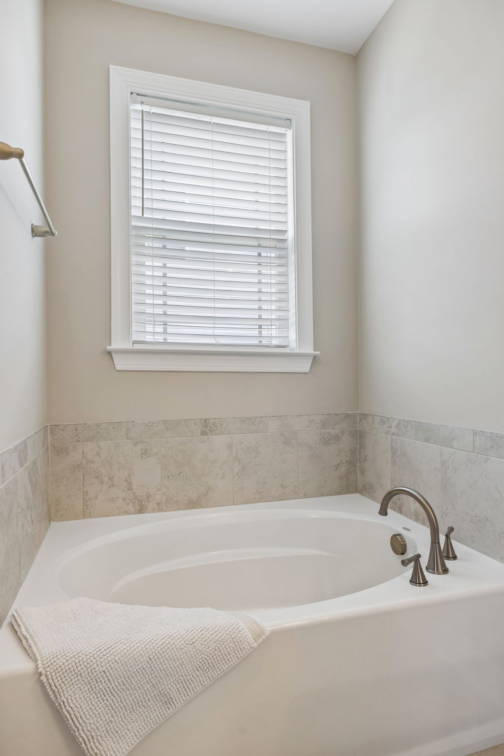 1002 Garrison Way Spring Hill, TN 37174 - Photo 48 of 63 a white bath tub sitting next to a window