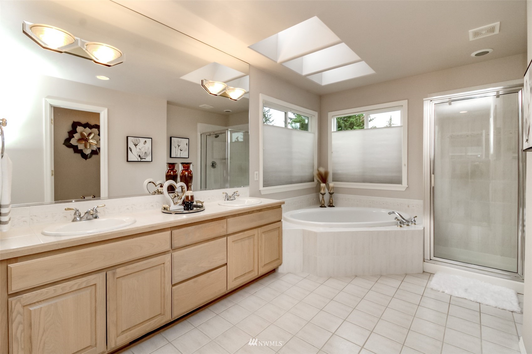 18910 3rd Street East Lake Tapps, WA 98391 - Photo 12 of 18 a spacious bathroom with a double vanity sink mirror and bathtub