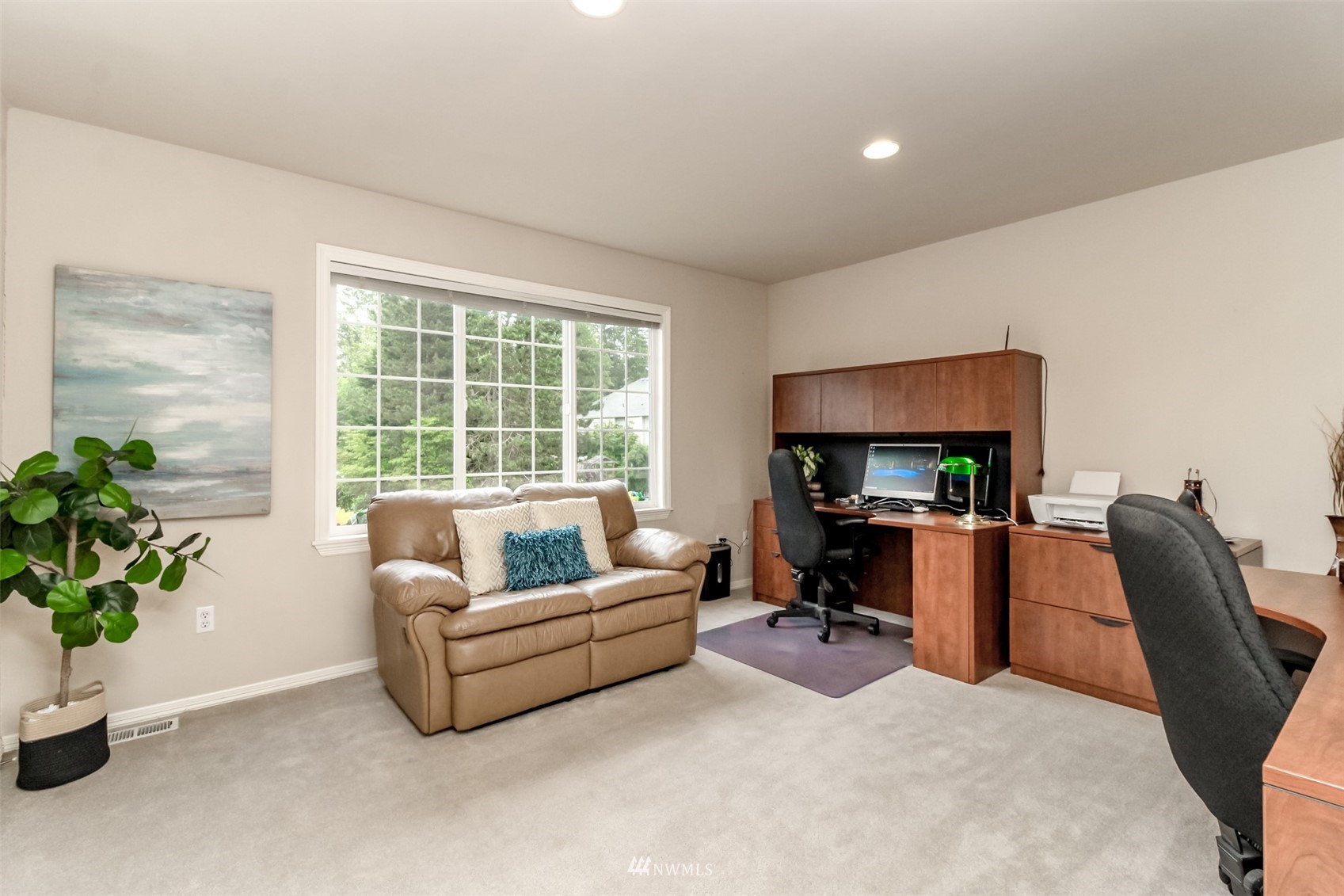 18910 3rd Street East Lake Tapps, WA 98391 - Photo 13 of 18 a living room with furniture floor to ceiling window and a flat screen tv