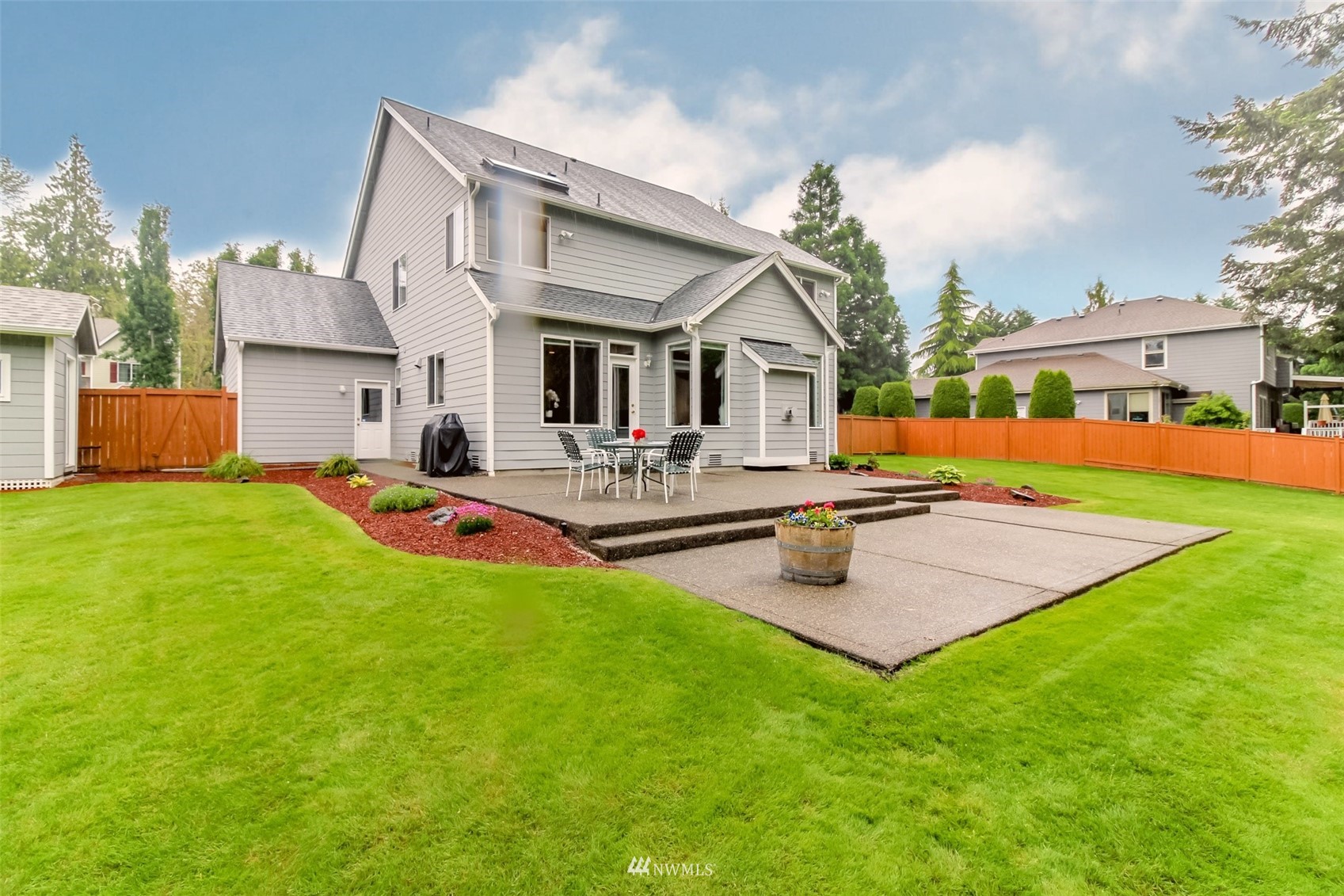 18910 3rd Street East Lake Tapps, WA 98391 - Photo 16 of 18 a view of an house with swimming pool garden and patio