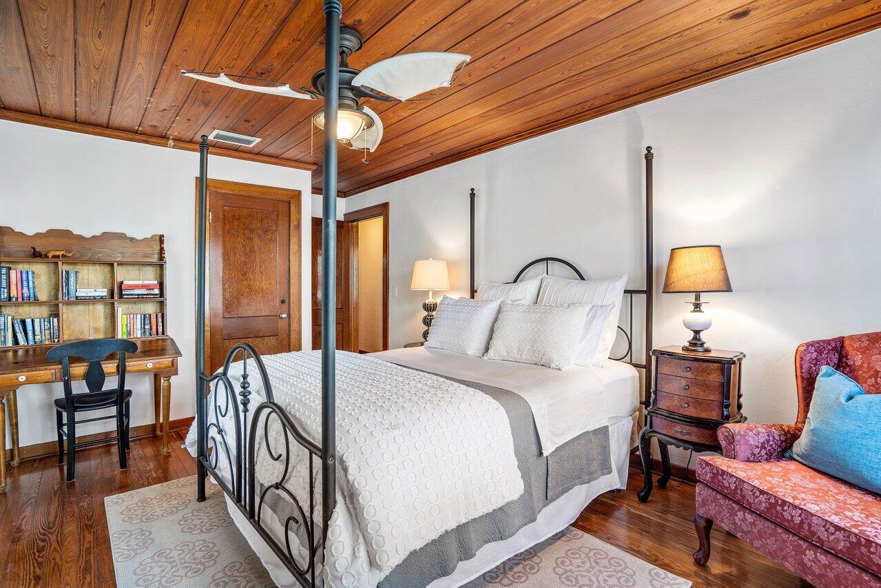 102 Southeast 7th Avenue, Unit VILLA 2 Delray Beach, FL 33483 - Photo 16 of 28 a bedroom with bed and wooden floor