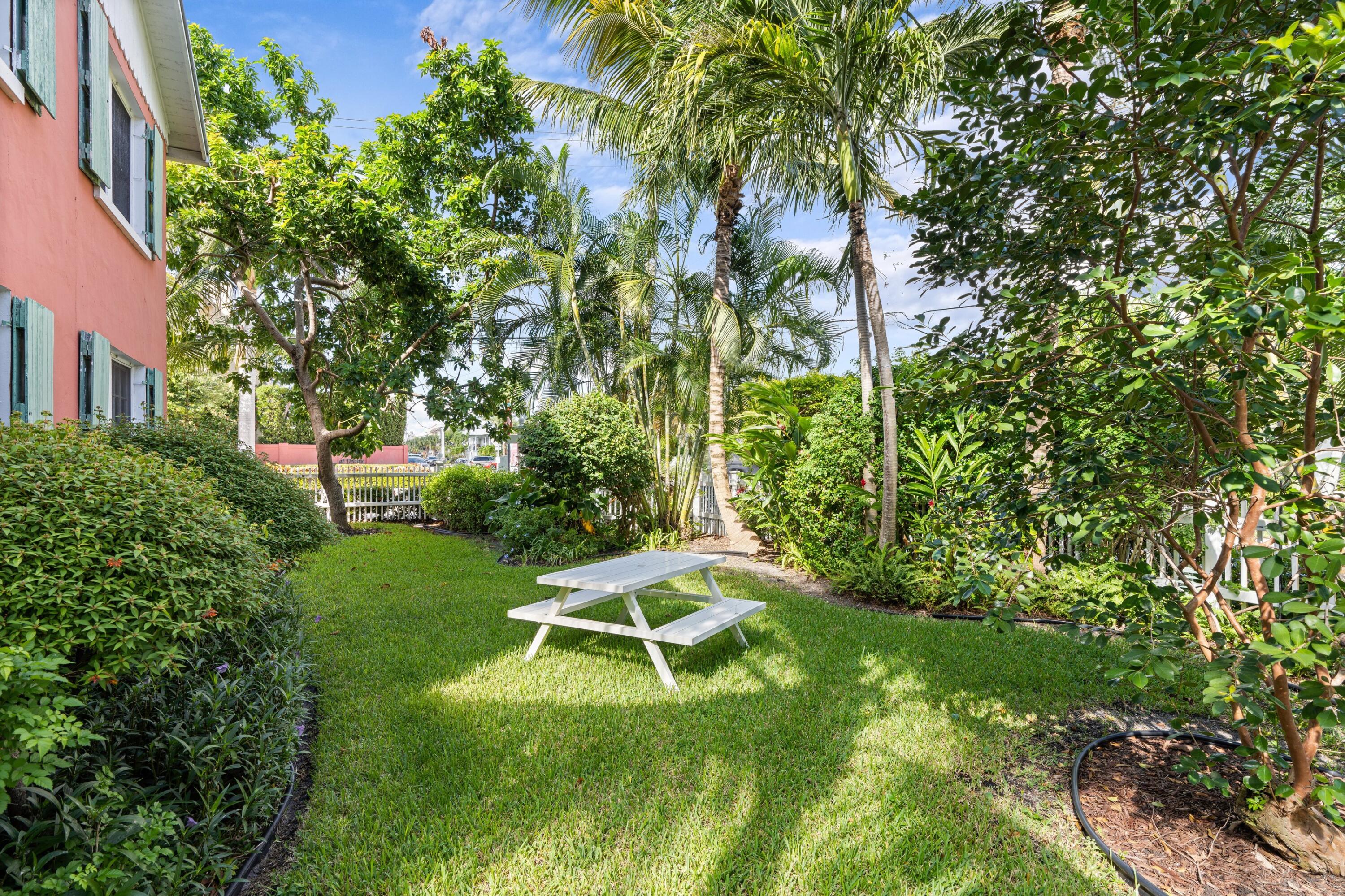102 Southeast 7th Avenue, Unit VILLA 2 Delray Beach, FL 33483 - Photo 25 of 28 a garden with lots of trees
