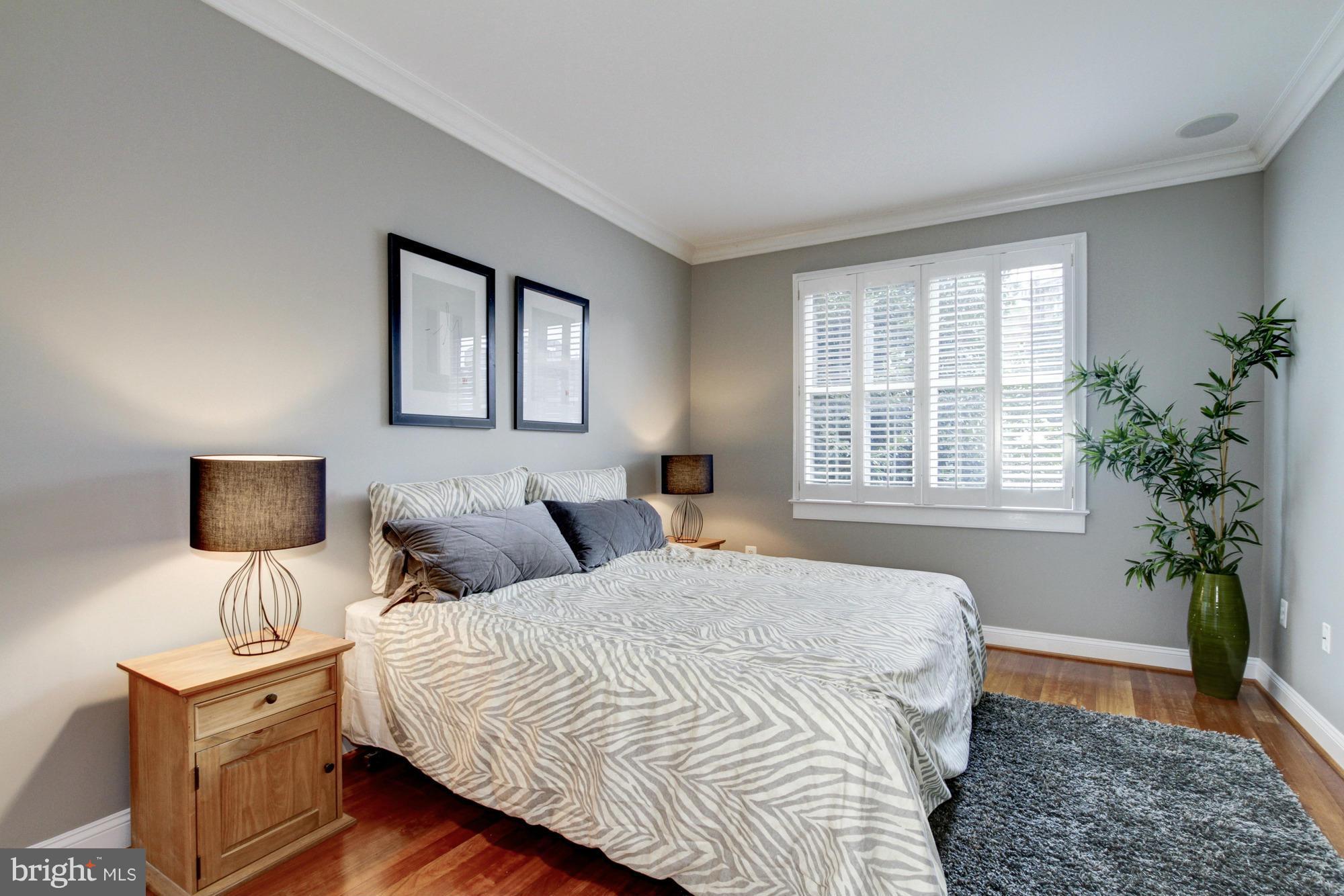27 Logan Circle Northwest, Unit 1 Washington, DC 20005 - Photo 17 of 30 a bedroom with bed and window
