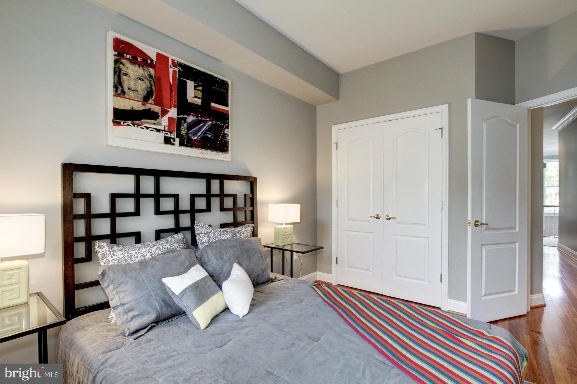 27 Logan Circle Northwest, Unit 1 Washington, DC 20005 - Photo 23 of 30 a living room with furniture and wooden floor