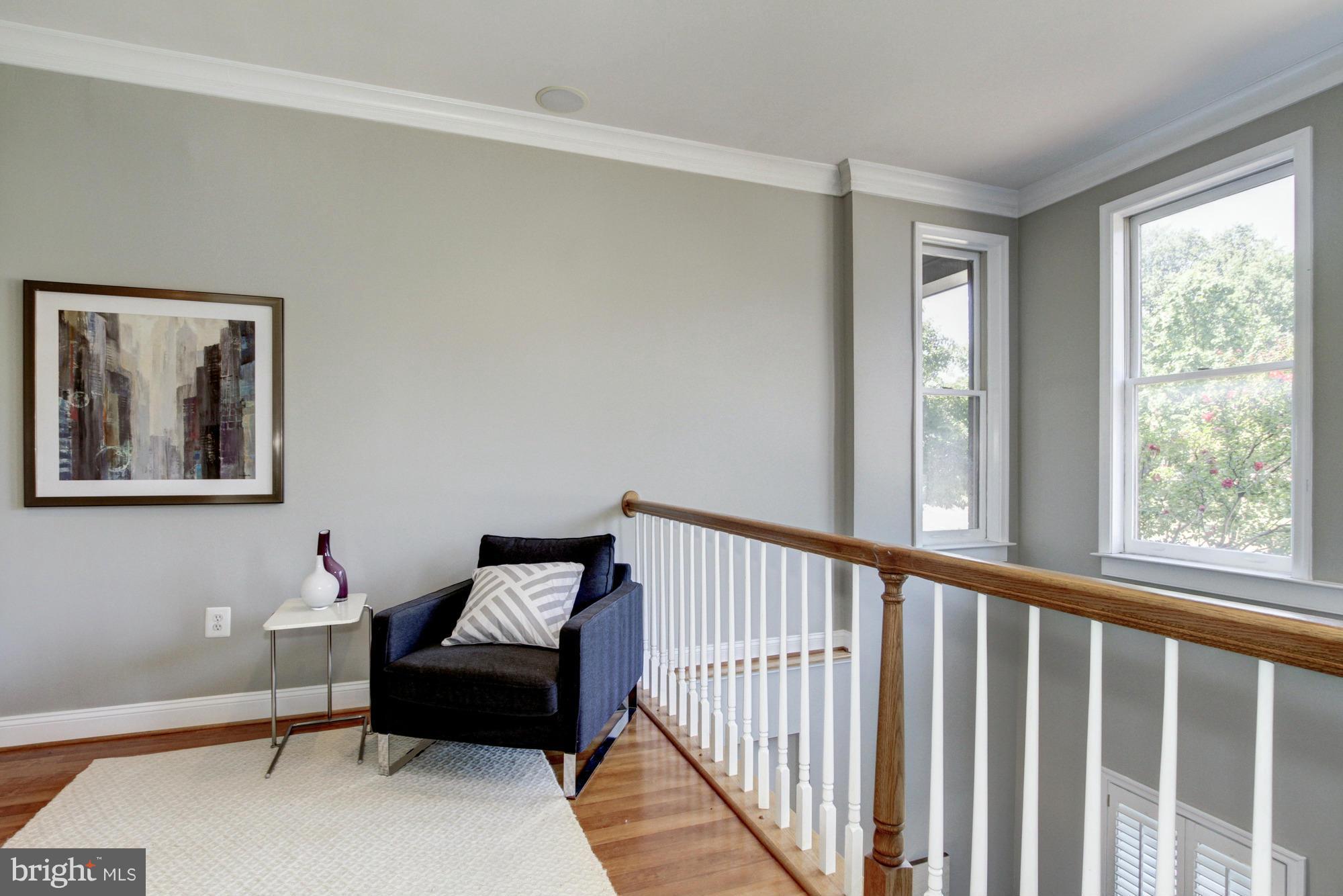 27 Logan Circle Northwest, Unit 1 Washington, DC 20005 - Photo 27 of 30 a living room with furniture and a window