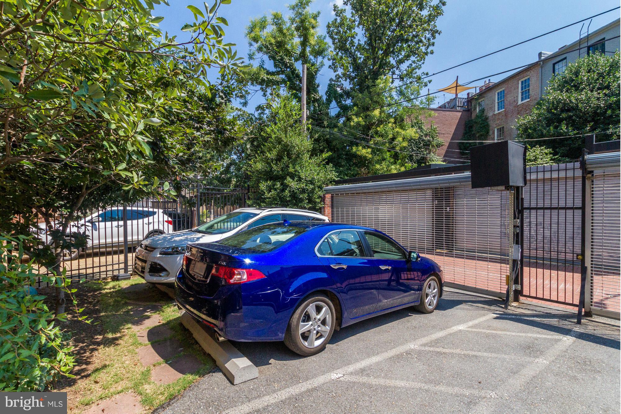 27 Logan Circle Northwest, Unit 1 Washington, DC 20005 - Photo 30 of 30 a car parked in front of a house