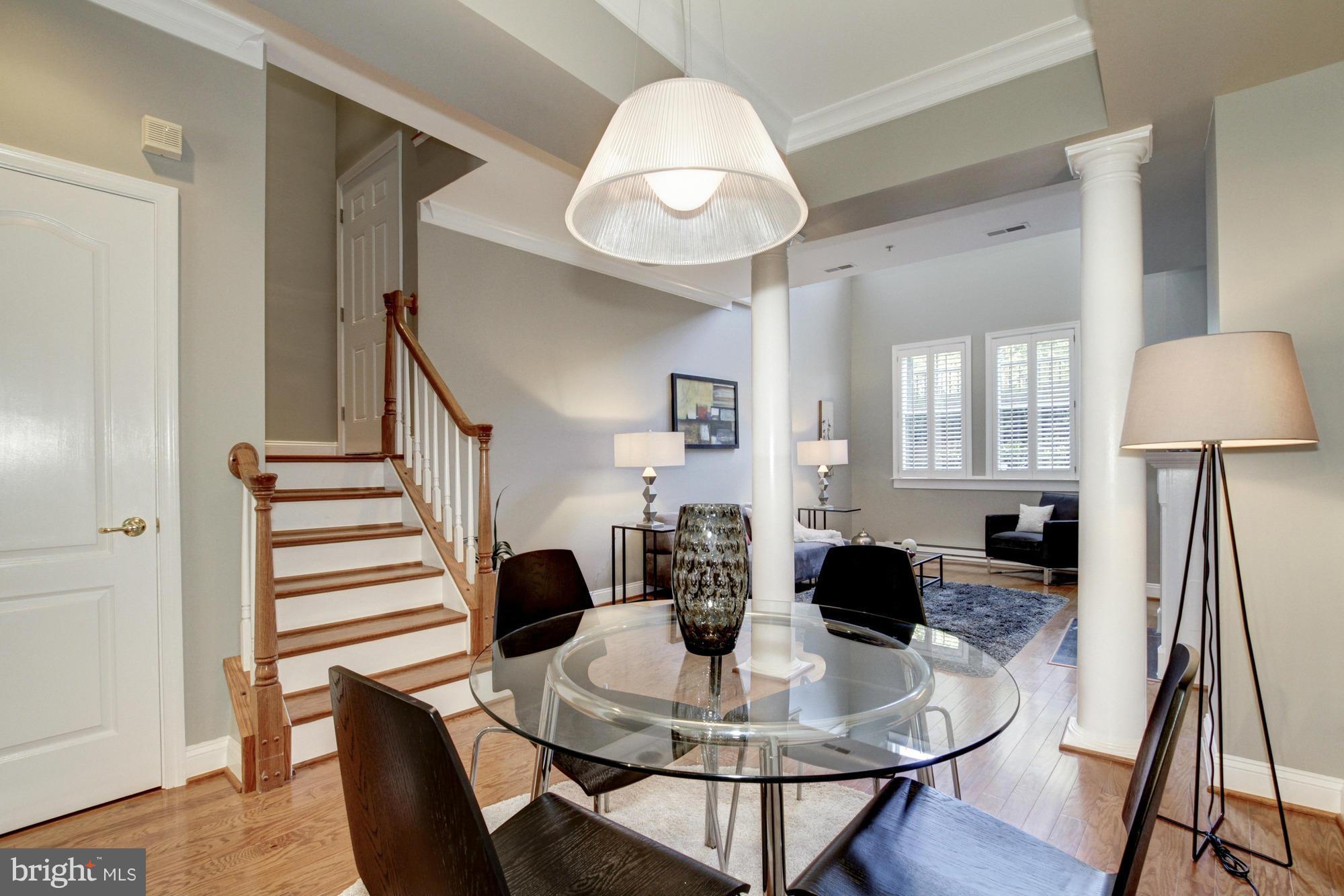 27 Logan Circle Northwest, Unit 1 Washington, DC 20005 - Photo 4 of 30 a view of a dining room with furniture and wooden floor