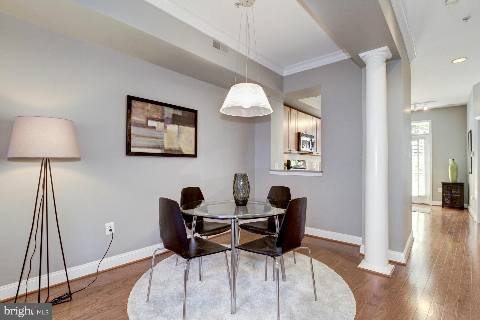 27 Logan Circle Northwest, Unit 1 Washington, DC 20005 - Photo 6 of 30 a view of a dining room with furniture and wooden floor