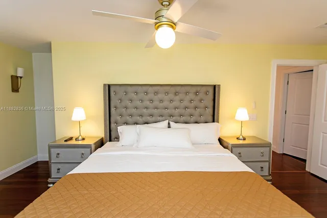 a bedroom with a bed and a lamp