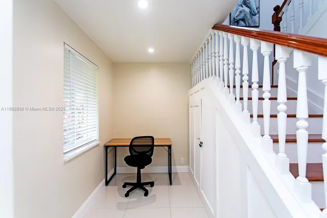 a view of a hallway with workspace