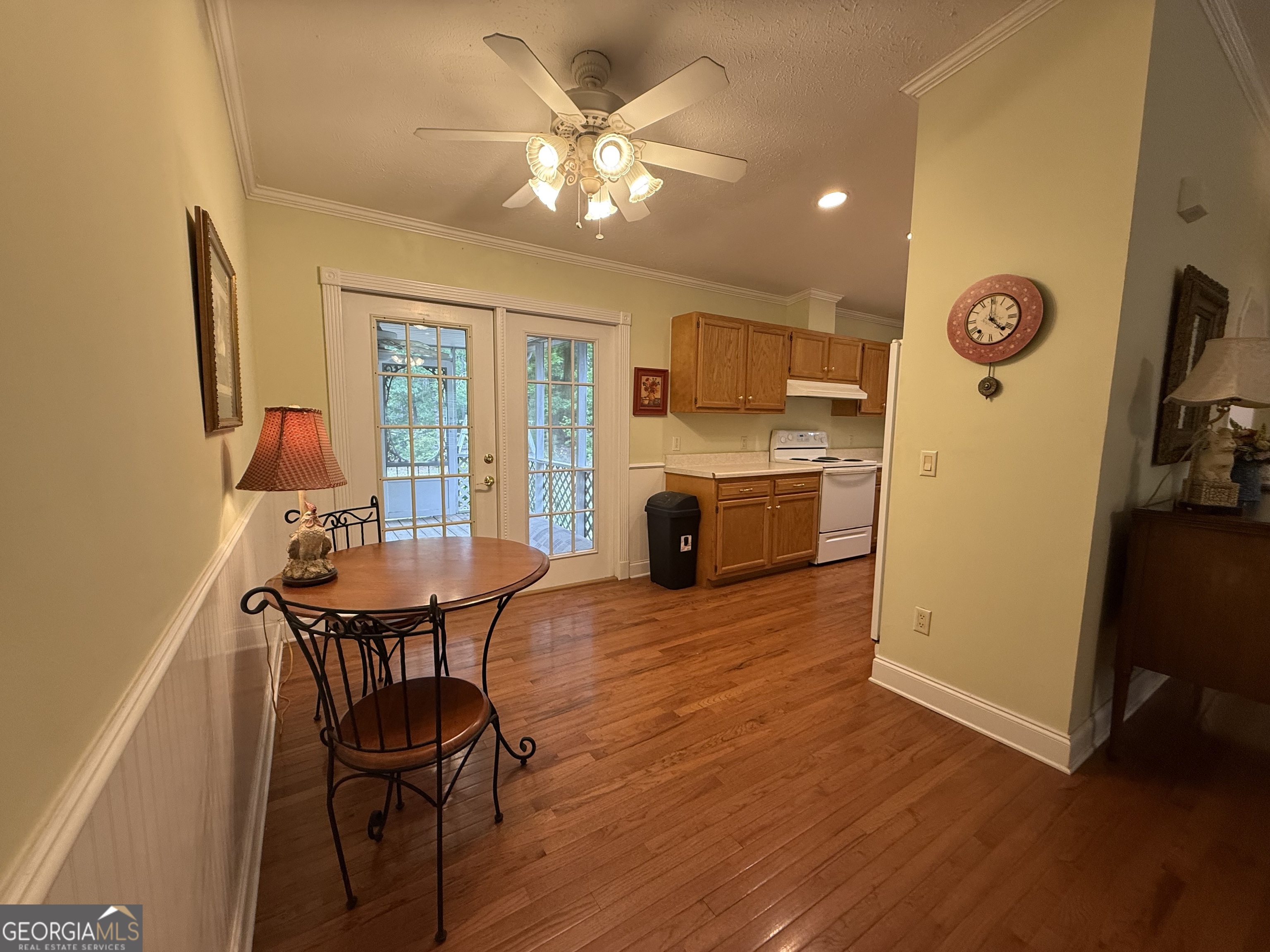 1081 Marshall Church Road Thomson, GA 30824 - Photo 9 of 26 a view of a dining room with furniture a chandelier and wooden floor