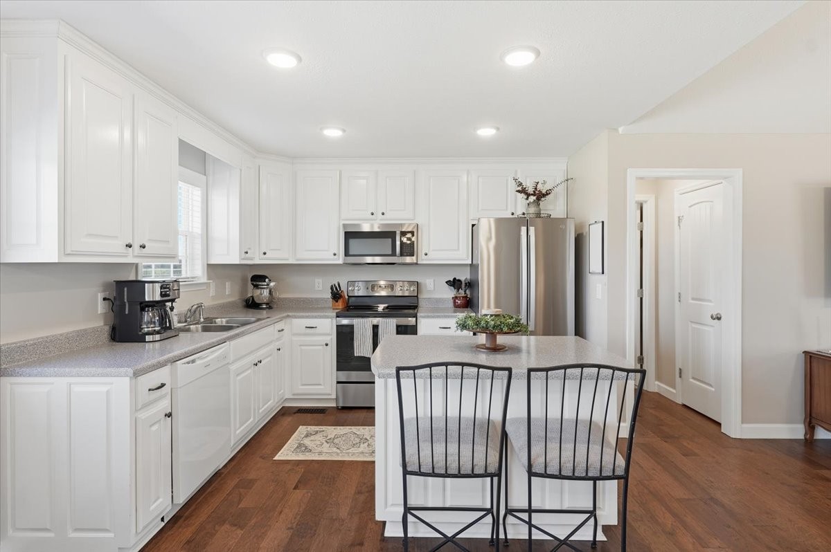186 L Mitchell Road Flintville, TN 37335 - Photo 12 of 40 a kitchen with stainless steel appliances granite countertop a refrigerator sink and cabinets