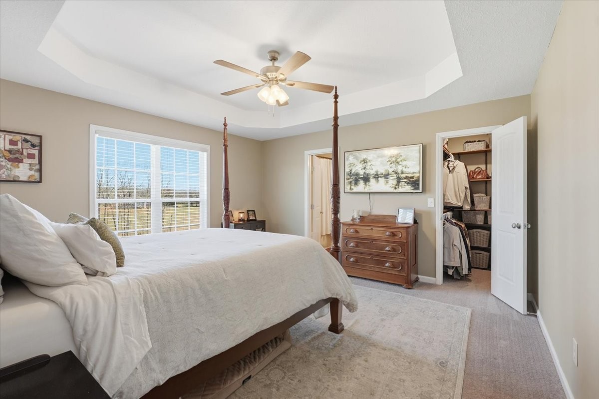 186 L Mitchell Road Flintville, TN 37335 - Photo 16 of 40 a bedroom with a bed closet and flat tv screen