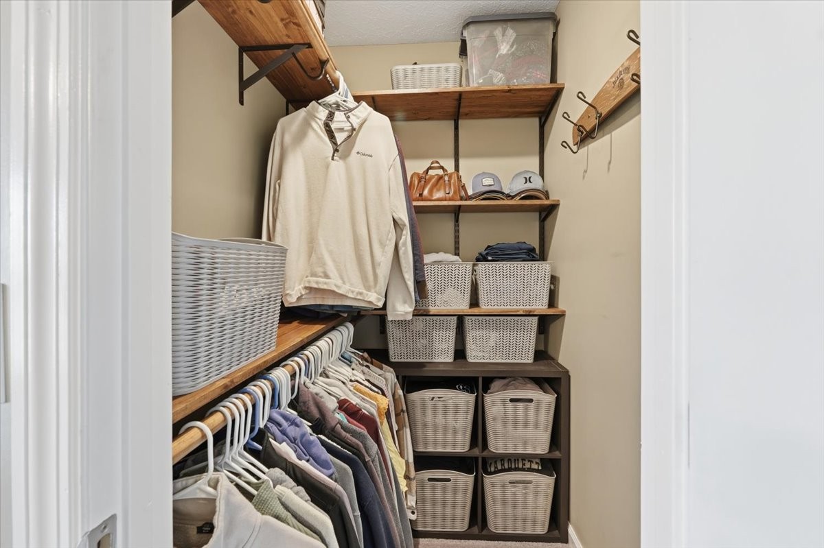 186 L Mitchell Road Flintville, TN 37335 - Photo 18 of 40 a view of walk in closet with clothes and shoes