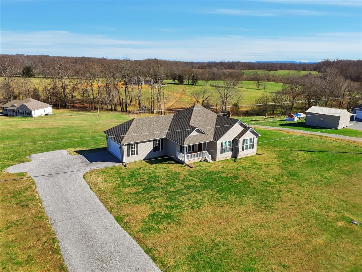 186 L Mitchell Road Flintville, TN 37335 - Photo 2 of 40 a view of a house with a yard and pool