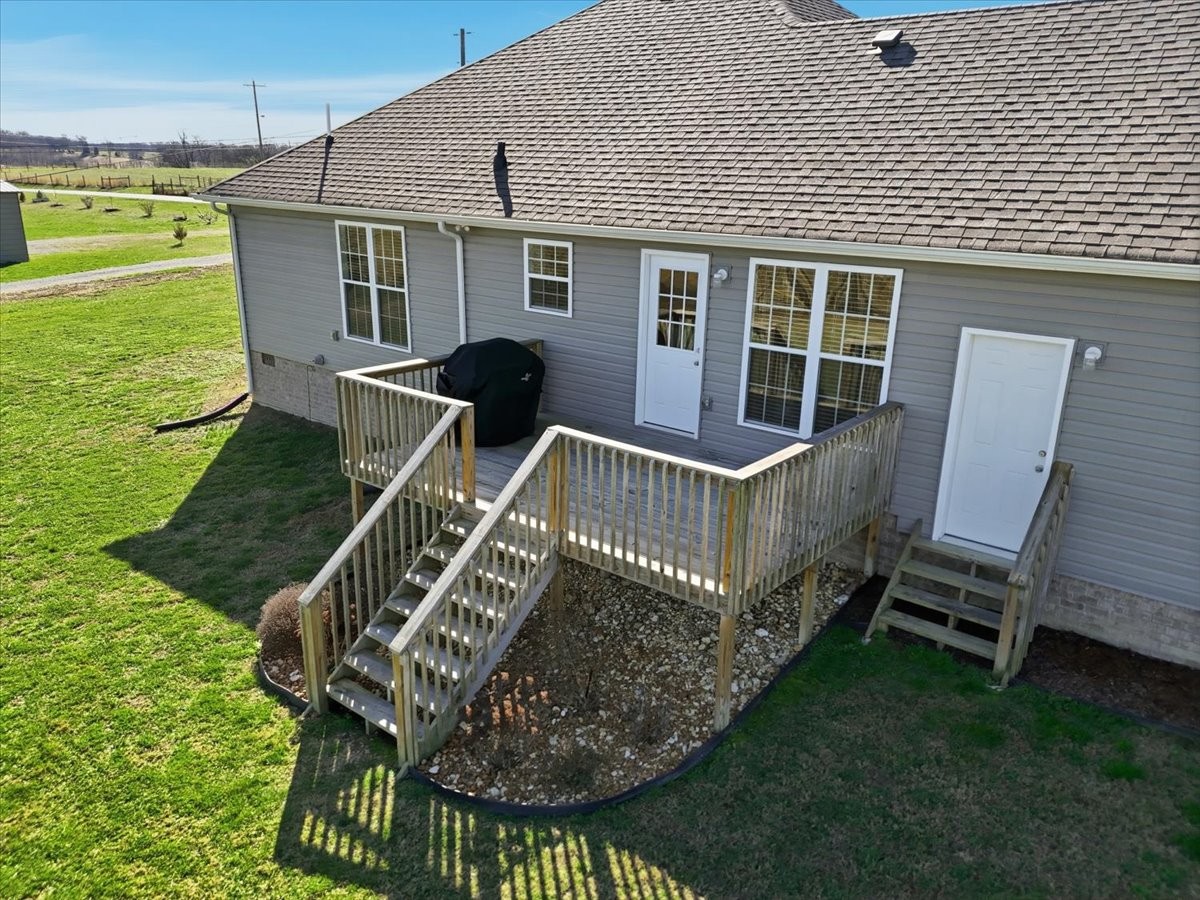 186 L Mitchell Road Flintville, TN 37335 - Photo 31 of 40 a view of a house with backyard and sitting area