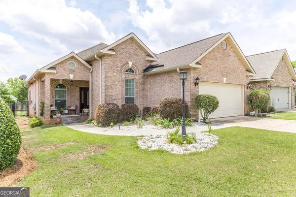 a front view of a house with a yard