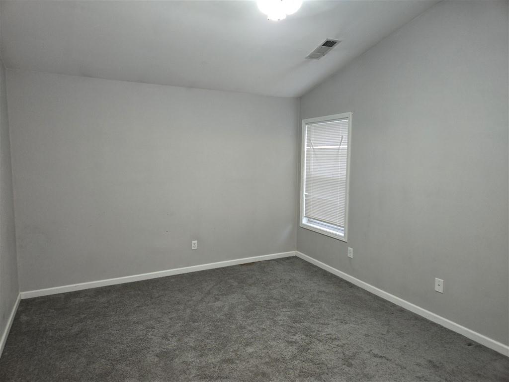 1558 Silver Ridge Drive Southwest Austell, GA 30106 - Photo 23 of 24 an empty room with a window