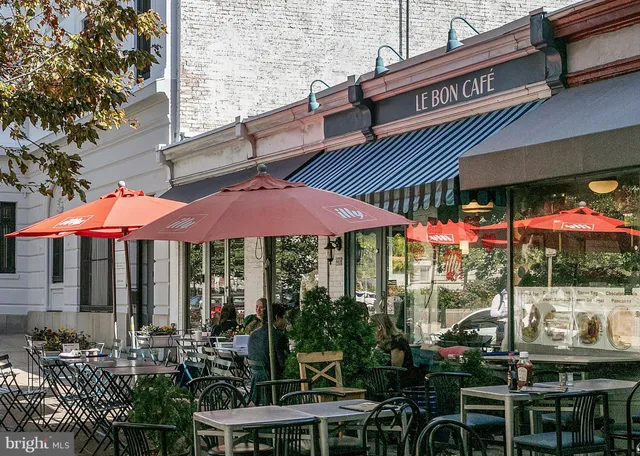 a view of a cafe with sitting area