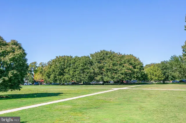 a sign board on a street corner