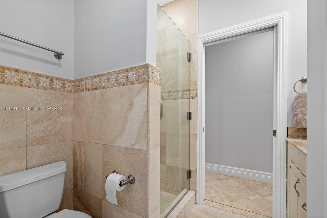 3060 Hampton Place Boca Raton, FL 33434 - Photo 11 of 60 a bathroom with a shower and a toilet