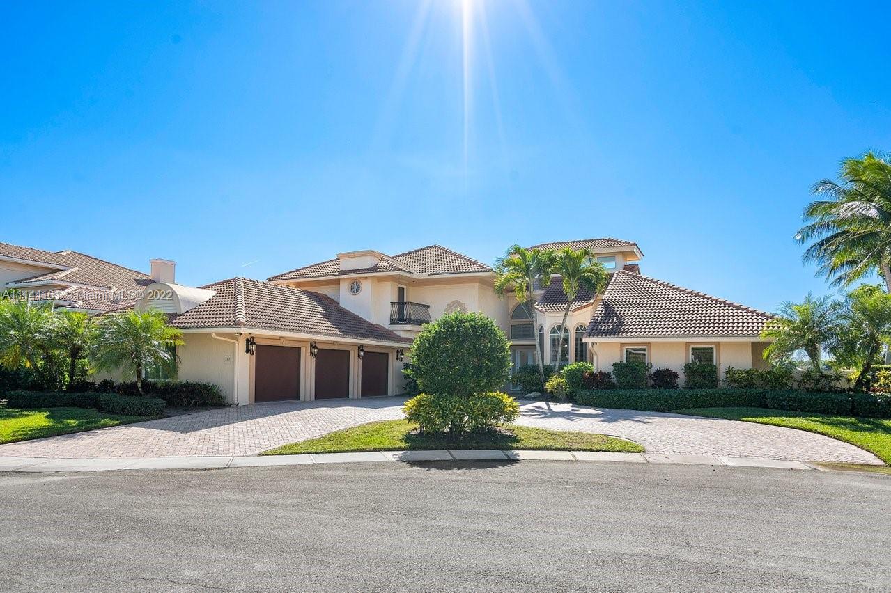 3060 Hampton Place Boca Raton, FL 33434 - Photo 3 of 60 a front view of a house with a yard and potted plants