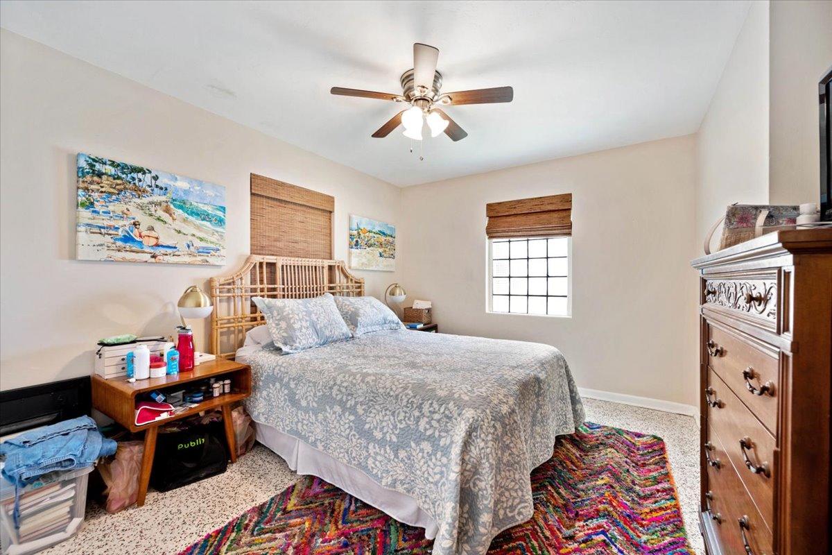 200 East 28th Street Riviera Beach, FL 33404 - Photo 11 of 22 a bedroom with a bed and wooden floor