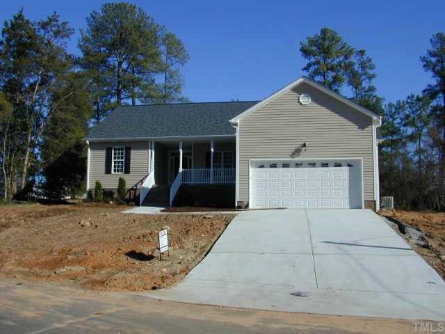 3901 Willow Oak Road Raleigh, NC 27604 - Photo 1 of 4 a view of a house with a yard