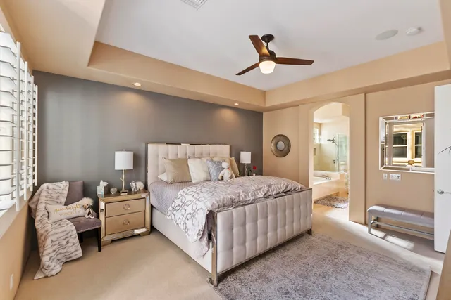 a bedroom with bed and window