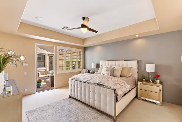 a bedroom with a large bed and a large window