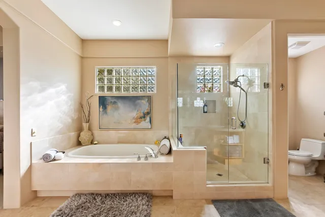 a bath tub sitting next to a bathroom sink