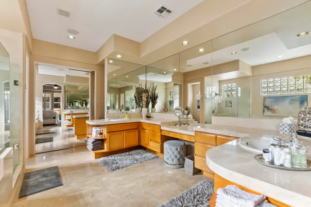 a large white kitchen with a large window