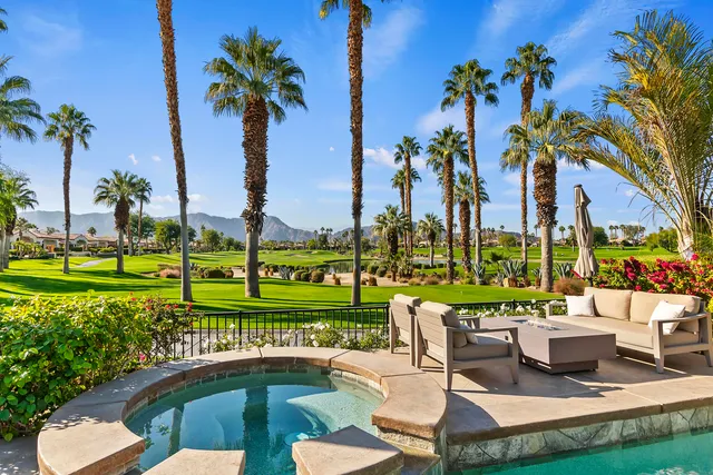 a view of a swimming pool and a garden