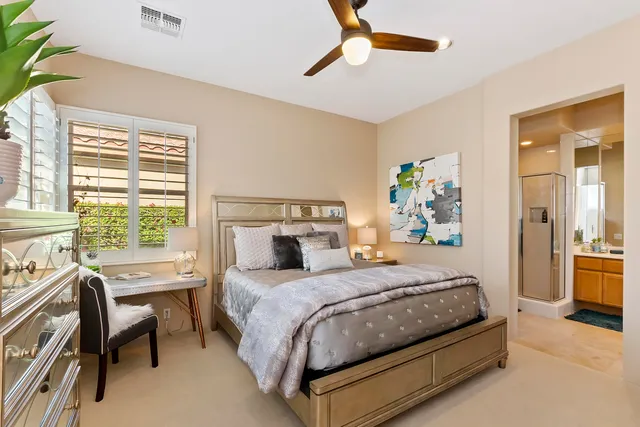 a bedroom with a bed and a table