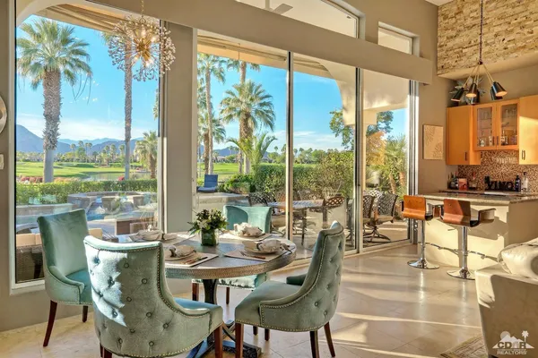 a view of a dining room with furniture window and outside view