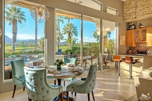 a view of a dining room with furniture window and outside view