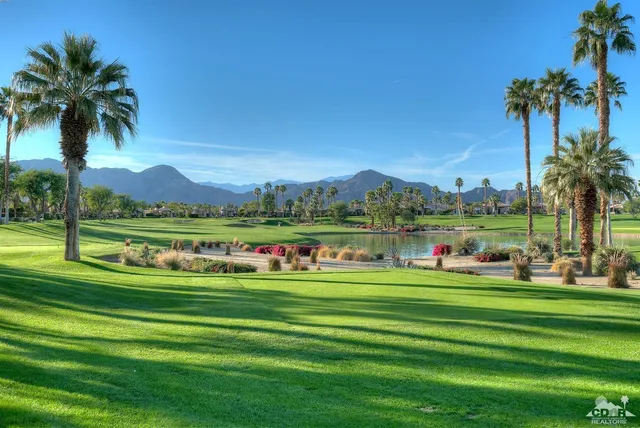 a front view of a city with lots of residential buildings and ocean view