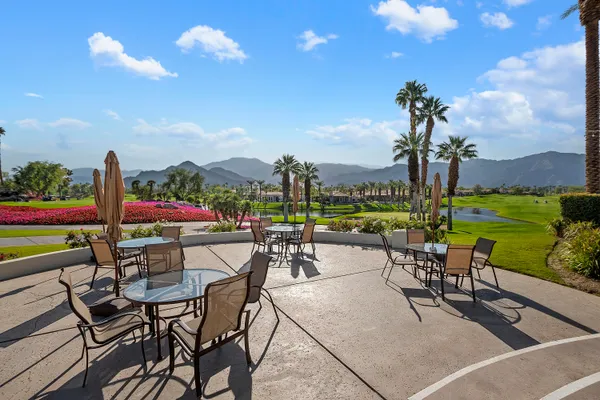 a view of a terrace with furniture and garden