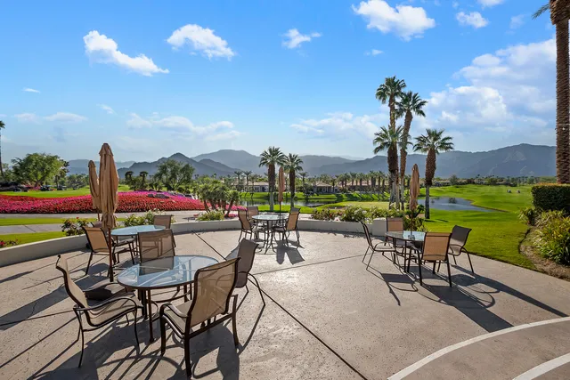 a view of a terrace with furniture and garden