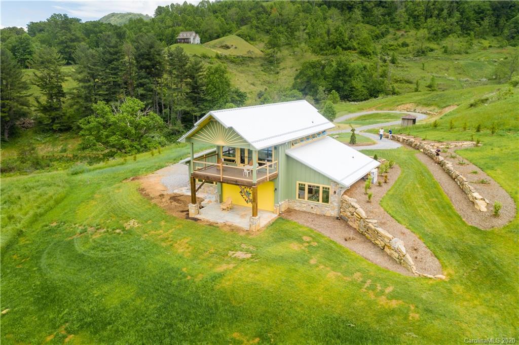 618 Glades Road Clyde, NC 28721 - Photo 22 of 40 an aerial view of a house with swimming pool garden and patio