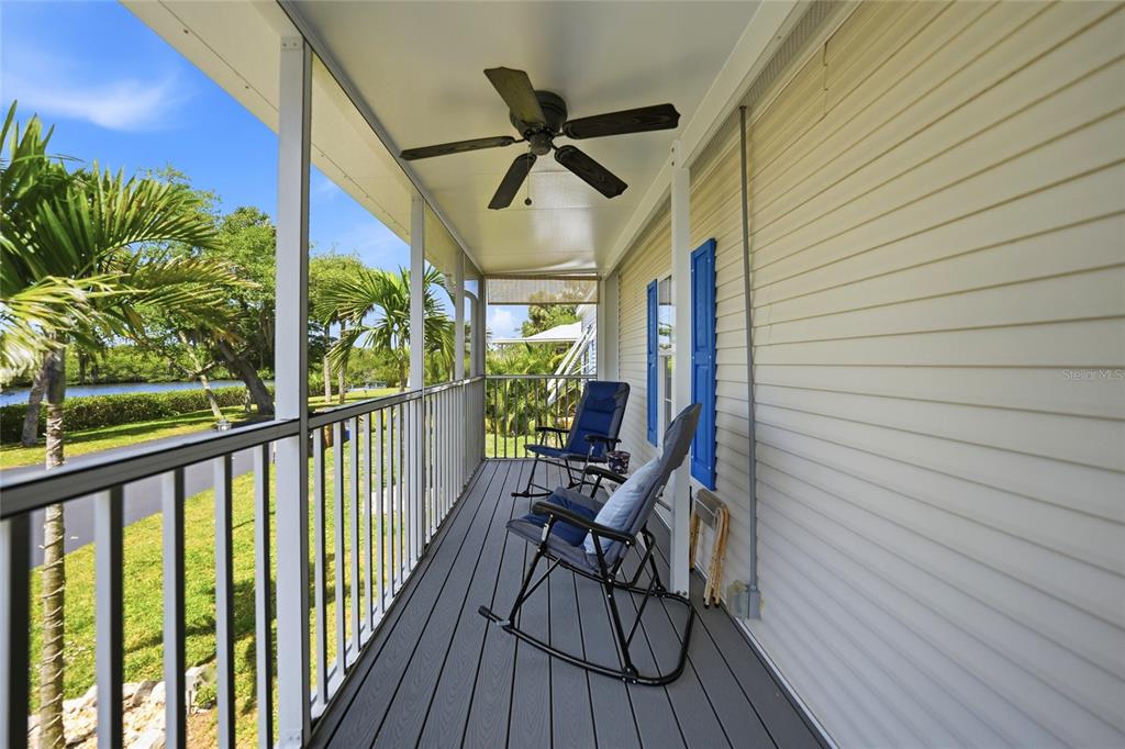 10303 Burnt Store Road, Unit 143 Punta Gorda, FL 33950 - Photo 23 of 42 a view of a porch with wooden floor