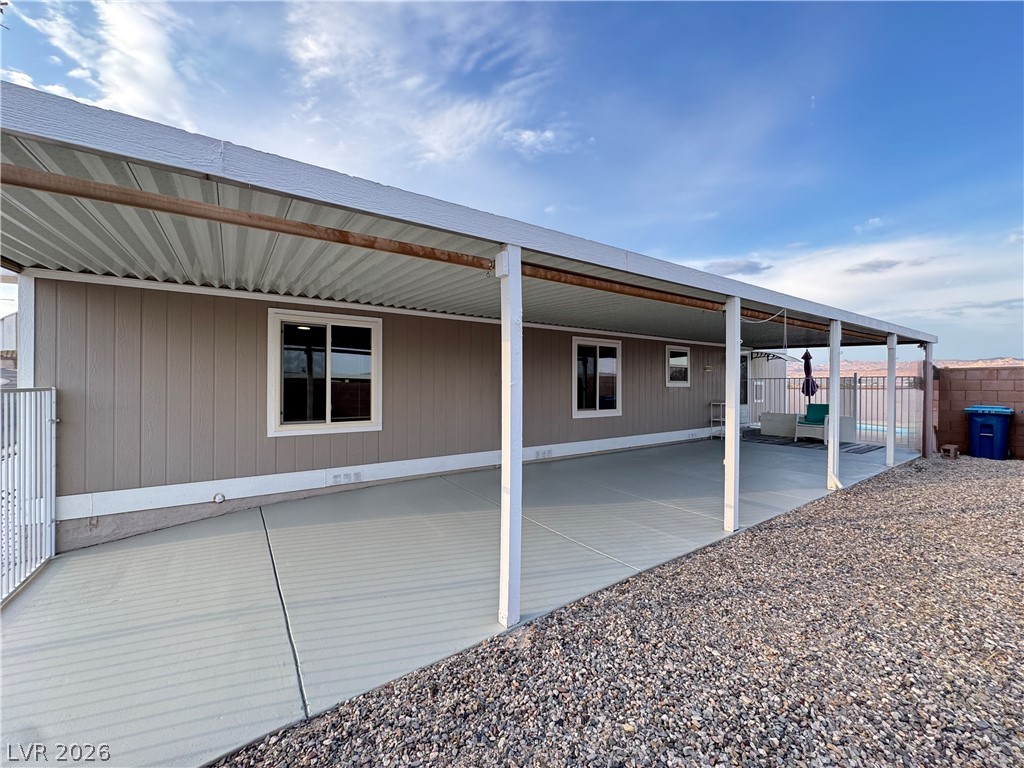 3250 Del Monte Street Laughlin, NV 89029 - Photo 50 of 57 A spacious covered patio extends along the side of this residence, offering an ideal setting for outdoor enjoyment.