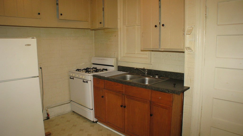 344 East Main Street Fall River, MA 02724 - Photo 2 of 6 a close view of a sink and dishwasher with refrigerator